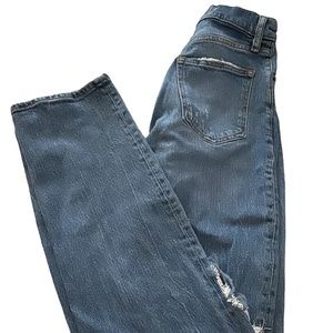 Blue jeans with holes.